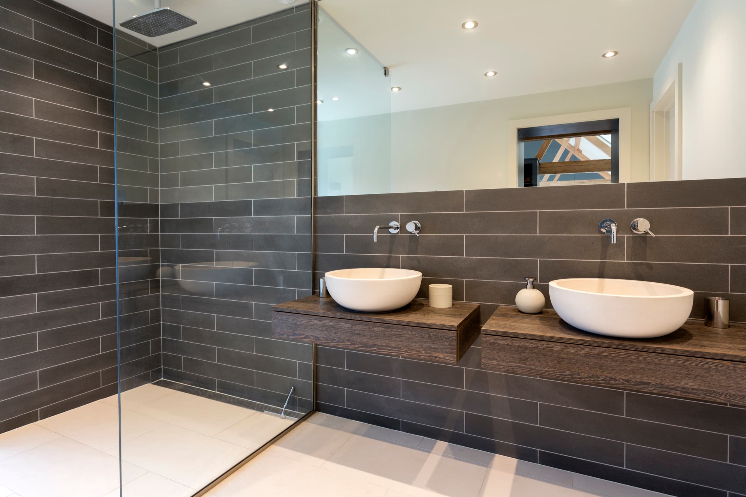 Gray tile bath with rain shower