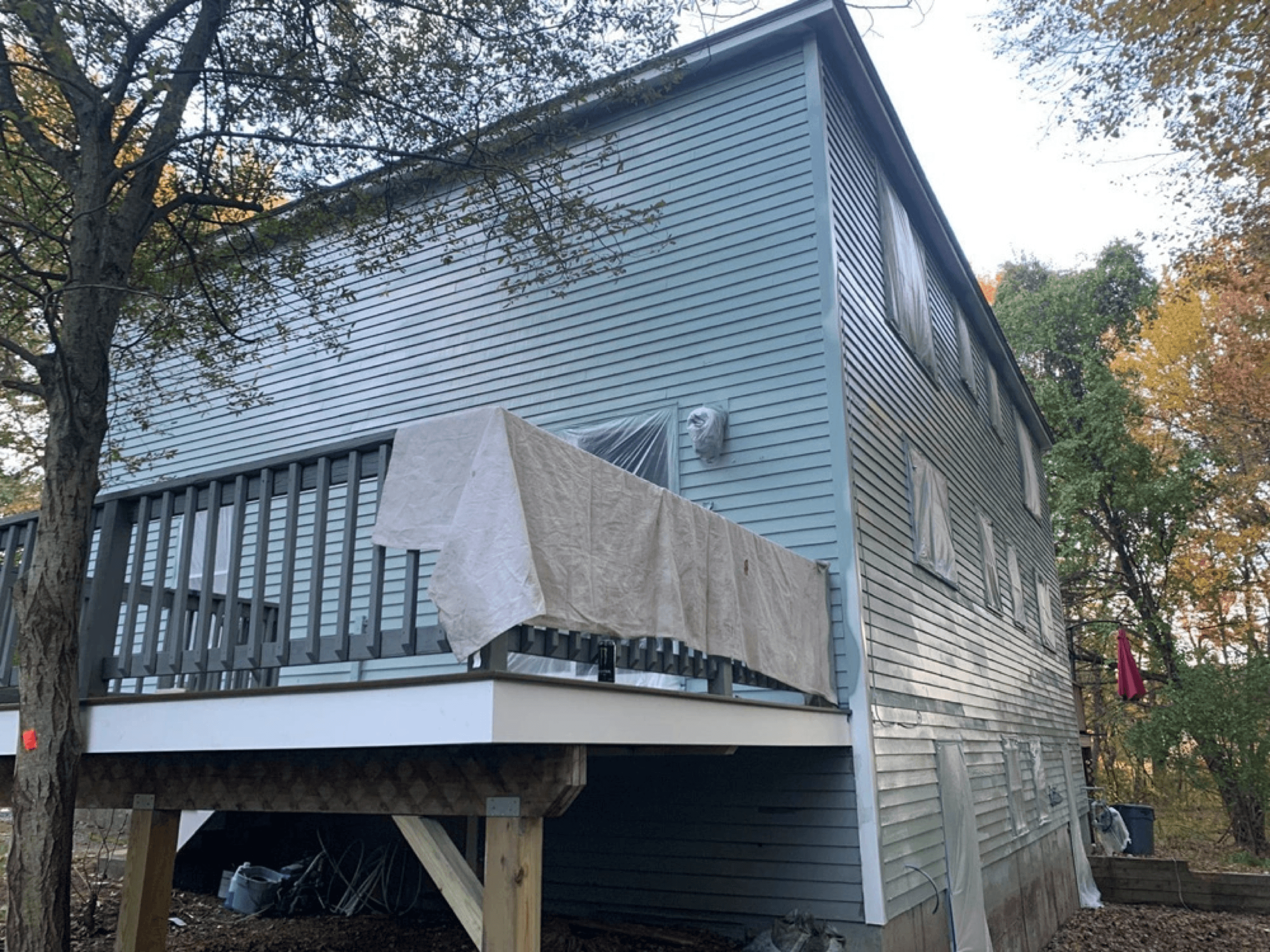 Gray house exterior with new deck