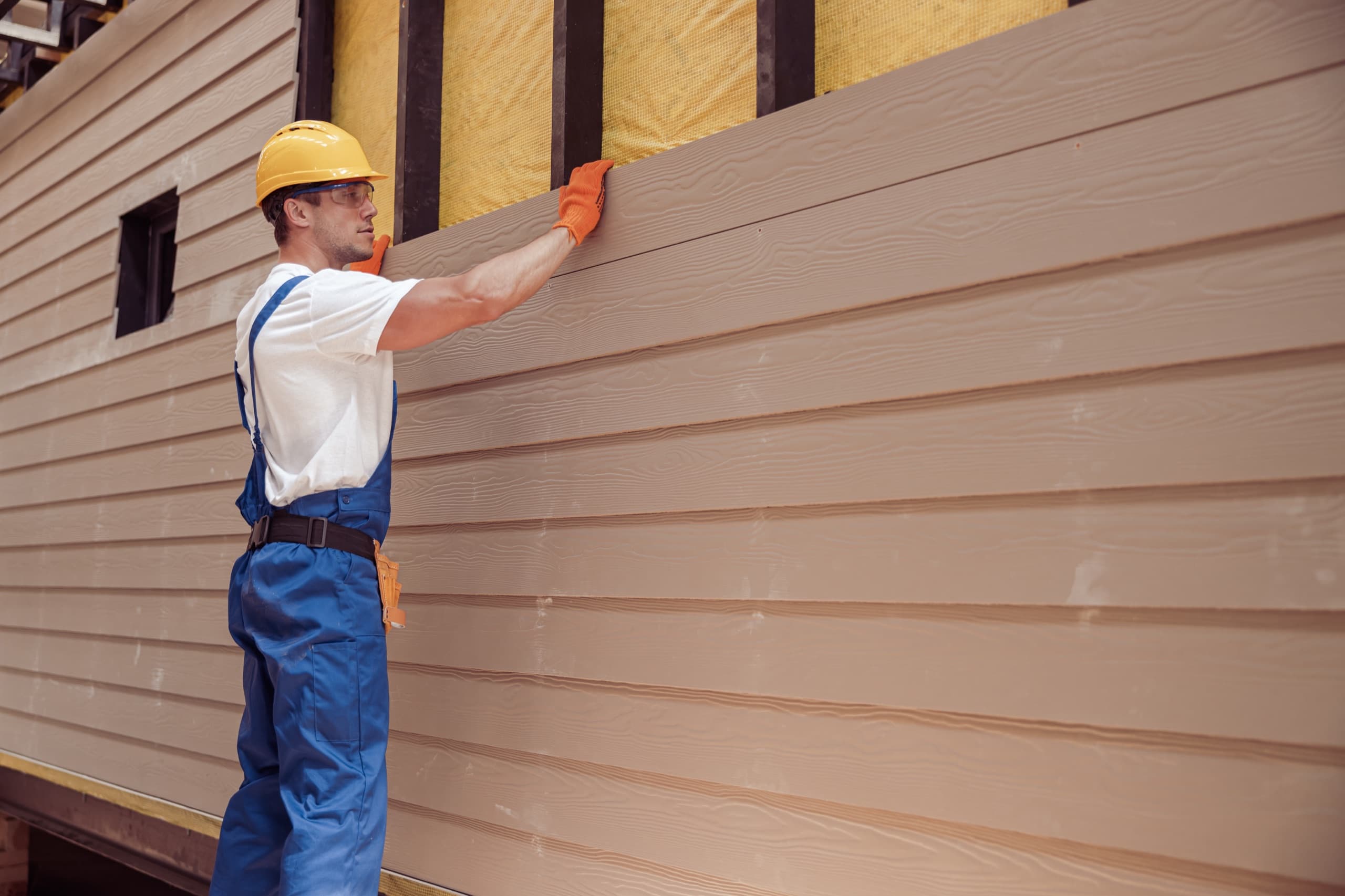 Crew installing new siding